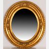 An American Gilt Framed Oval Mirror