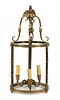 A Bronze and Glass Lantern Height 21 x diameter 9 3/4 inches.