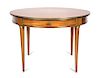 A Directoire Style Gilt Metal Mounted Fruitwood Center Table Height 29 x diameter 42 inches.