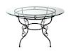 An Iron and Glass Outdoor Table Height 29 x diameter 48 inches.