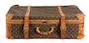 A Louis Vuitton Leather Soft-Sided Suitcase Height 8 1/2 x width 27 x depth 18 inches.