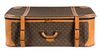 A Louis Vuitton Leather Soft-Sided Suitcase Height 10 x width 31 x depth 20 inches.