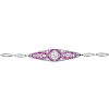 An early 20th century ruby and diamond bracelet. Of marquise-shape outline, the circular-cut diamond