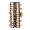 An early 20th century gold foil-back garnet and split pearl clasp. Designed as five alternating foil