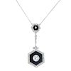 A diamond and onyx pendant. The circular-cut diamond collet, within a hexagonal-shape onyx and old-c