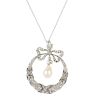 An early 20th platinum century diamond and cultured pearl pendant. The old-cut diamond and cultured