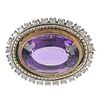 An amethyst and diamond brooch. The oval-shape amethyst collet, within a brilliant-cut diamond surro