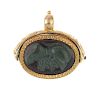 A hardstone swivel fob. The oval hardstone cameo, depicting a Roman soldier, within a textured surro