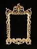 AN ITALIAN ROCOCO STYLE PARCEL GILT AND CARVED WOOD MIRROR, LATE 20TH CENTURY,