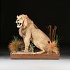 A VINTAGE TROPHY TAXIDERMY AFRICAN LION ON LANDSCAPED BASE, BY TOM'S TAXIDERMY, VICTORIA, TEXAS,
