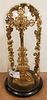 CARVED GILT WOOD CROSS 17 1/2" UNDER A 18 1/2"H X 8 1/2" DIAM. GLASS DOME
