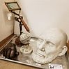 TRAY DESK ITEMS MAGNIFIER ON STAND, GLOBE 6 1/2", LINCOLN PLASTER DEATH MASK AND COPPER PLATED PLASTER HAND OF LINCOLN COPYRIGHT 1886