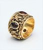 14 Karat Gold Band, set with five garnets, size 6, 11.5 grams. Provenance: Estate of Wallace Bradway, New Haven, CT.