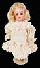 Simon & Halbig K&R bisque socket head girl. 6" doll with mohair wig, glass sleep eyes, open mouth with teeth, on five-piece walker body with molded an