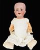 Kammer & Reinhardt 126 bisque socket head character baby. 20" doll with glass sleep eyes, open mouth with teeth, on five-piece composition bent limb b