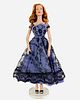 16" Tonner doll dressed in a periwinkle dress with black lace and shoes. In great condition. No box.