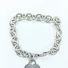 Tiffany & Co Sterling Silver Heart Charm Bracelet
