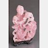 A Chinese Carved Rose Quartz Figure of Guanyin on a Carved Hardwood Stand.
