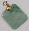 JEWELRY. 14kt Gold and Carved Jade Pendant.