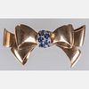 An 18kt. Yellow and White Gold Sapphire Bow Form Brooch,