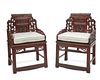 A pair of Chinese carved wood armchairs