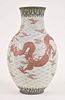 A Meiji era ovoid ceramic vase with Moriage ornament by Kinkozan