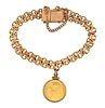 A mid 20th century 14 karat gold bracelet with Mexican 5 peso charm