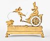 An early 19th century French figural mantel clock featuring Aphrodite in her chariot