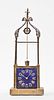 A late 19th century well form mantel clock with conical pendulum by Andre Romain Guilmet