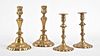 A lot of two pair of 18th century English brass candlesticks