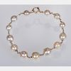 A 14kt. Yellow Gold and Graduated Cultured Pearl Bracelet,