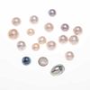 Diez y ocho medias perlas cultivadas distintos tonos y calidades. Peso: 47.7 g.