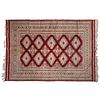 TAPETE. SXX. Estilo BOKHARA, lana y algodón, anudado semimecanizado, diseños geométricos, en tono rojo y beige. 220 x 155 cm aprox.