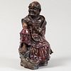 Chinese Shiwan Copper Red Glazed Earthenware Figure of an Ascetic