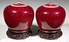 PAIR OF CHINESE QING 19TH C. SANG DE BOEUF COVERED JARS