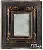 Continental ebonized and gilt decorated mirror