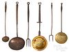 Six wrought iron and brass kitchen utensils
