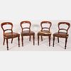  Four English Regency Mahogany and Leather Folding Campaign Chairs