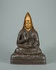A silver Tibetan buddha statue