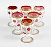 A matched set of six cranberry and white overlay drinking glasses, each with bucket bowl on prism cu