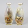 Two Royal Worcester hand painted vases, each of ovoid form below a short flared neck, one decorated