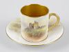 A Royal Worcester hand painted coffee cup and saucer, by John Stinton, decorated with view of Norham