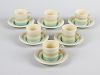 A Susie Cooper coffee set, comprising seven cups, six saucers and two milk jugs, having green, yello