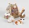 A Royal Crown Derby porcelain ornament modelled as a camel, white glazed and decorated in an Imari s