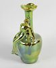 A Zsolnay Pecs Eosin lustre vase. Of long-necked shouldered ovoid form with applied seated female fi