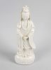A 19th century Chinese blanc de chine figure, modelled as Guanyin stood in flowing robes upon a wave