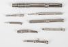 A group of silver and other metal pencils, to include three small examples, all with foliate engrave