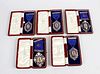 Five late 1920’s and early 1930’s enamelled silver medals presented by the Central Currant Office, e
