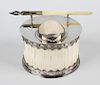 An ivory and silver plated inkstand, of oval form, the ivory body having plated cover with pierced b