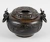A large bronze incense burner and cover, the domed pierced lid depicting an elder seated among prunu